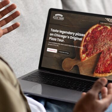 chicago-pizza-tours-website-on-computer-screen-person-lap